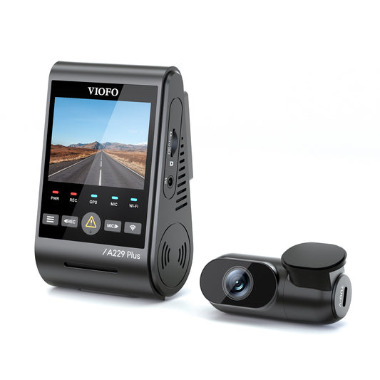Side view of the VIOFO A229 PLUS 2K DUO dashcam system, showcasing its front and rear cameras. The front camera features a 2K resolution lens, housed in a compact black unit with an LCD screen for easy viewing and controls. The rear camera, designed for capturing rear footage, is similarly small and unobtrusive, mounted discreetly on the rear windshield. The system is designed for high-definition video recording and enhanced vehicle surveillance