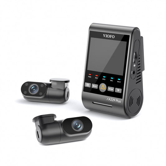 Overview of the VIOFO A229 Plus 2K 3CH dashcam system, featuring three cameras for full coverage. The front camera has a 2K resolution lens for high-quality video recording, while the rear and interior cameras are mounted to capture the rear and cabin views of the vehicle. The cameras are sleek and compact, with a black design and small LCD screens for easy monitoring. The system is designed for comprehensive, multi-angle surveillance while driving